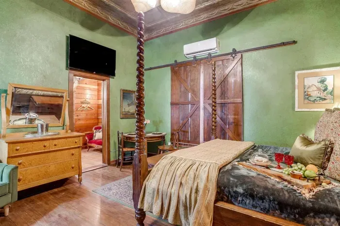 Cozy room with a smart TV, elegant wooden blinds, and thoughtful details for a comfortable stay