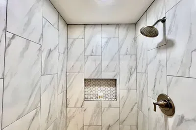 Newly remodeled bathroom with a huge walk-in shower, offering a spa-like experience during your stay