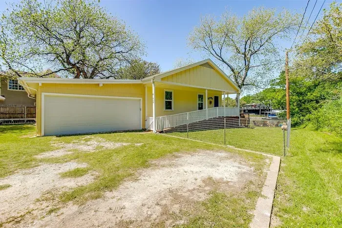 Driveway parking with room for multiple vehicles — convenient for families and boat trailers.