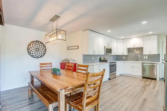 Dining area flowing into the kitchen — open layout perfect for shared meals and entertaining.