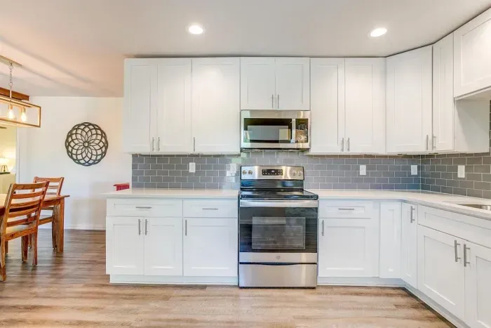 Bright, modern kitchen with stainless appliances and spacious countertops — fully equipped for cooking and entertaining.