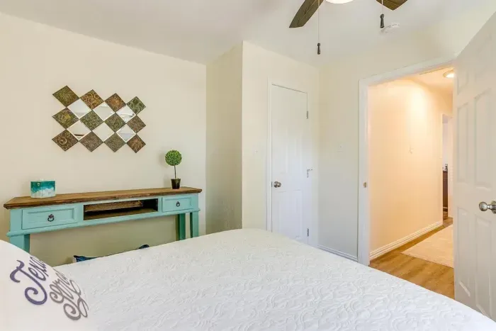 Second queen bedroom with Smart TV and cozy furnishings — ideal for couples or additional guests.