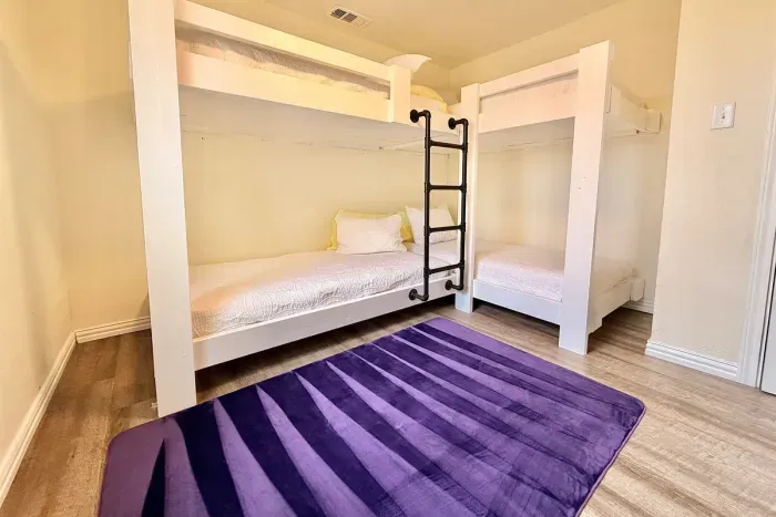 4 Twin beds in this 3rd bedroom perfect for sleeping the whole family!