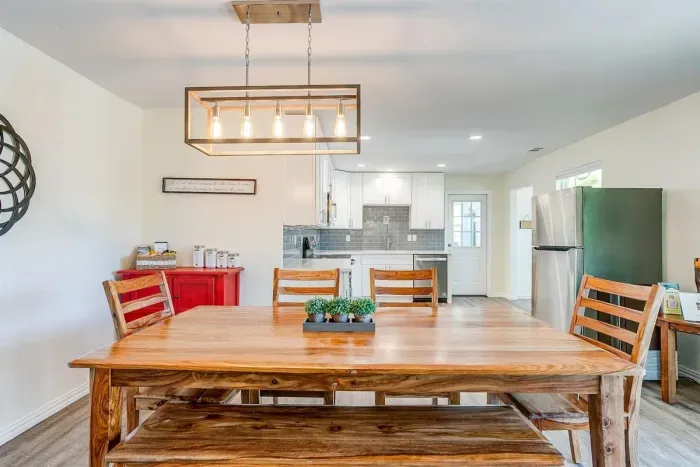 Large dining table with seating for the whole group — perfect for family meals, game nights, or morning coffee together.