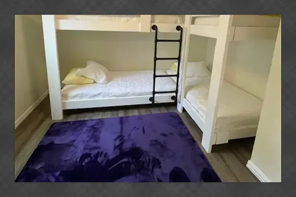 Third bedroom featuring two bunk beds (sleeps 4) — perfect for kids or group stays.