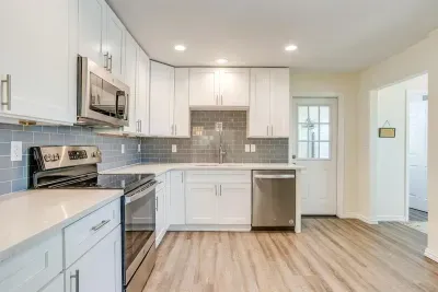 Additional kitchen angle highlighting updated cabinetry and generous counter space.
