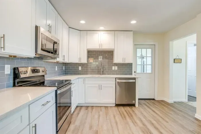 Additional kitchen angle highlighting updated cabinetry and generous counter space.