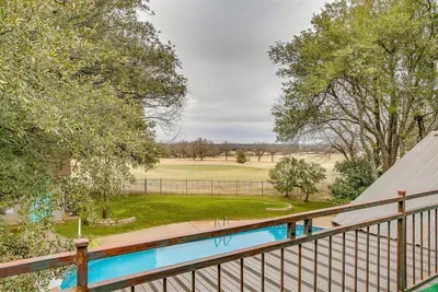 Enjoy your morning coffee or evening drinks on the private balcony off the master bedroom, offering panoramic views of the pool and the golf course