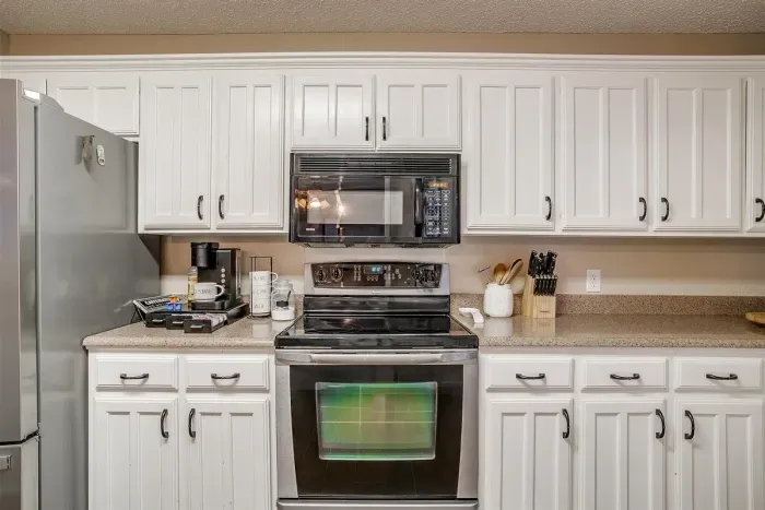 Bright and modern kitchen fully equipped with all the tools you need, including high-quality appliances, cookware, and a coffee bar to make your stay effortless and enjoyable