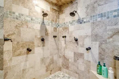 Indulge in the spa-like master ensuite bathroom featuring a double luxury shower with premium fixtures for ultimate relaxation