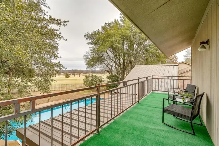 Private balcony off the master bedroom, offering a quiet space to unwind with sweeping views of the pool and golf course