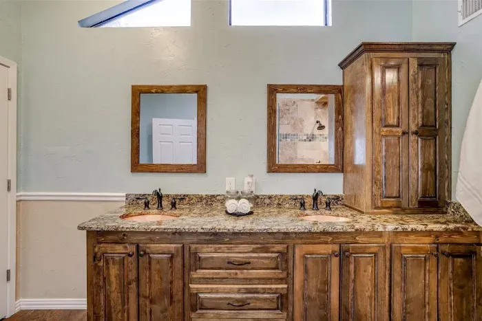 Unique bathroom with a stunning copper sink and elegant decor, adding a touch of rustic charm to your stay