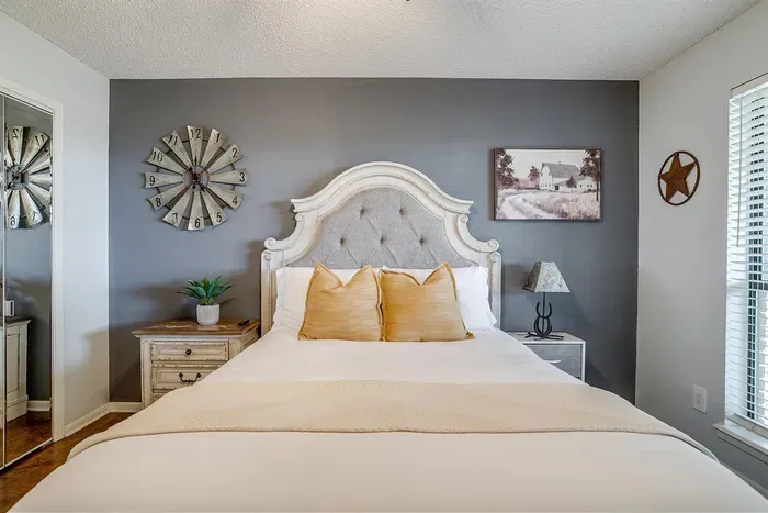 Second bedroom featuring a cozy queen-size bed, modern decor, and a smart TV for a comfortable and convenient stay