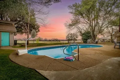 Take a refreshing dip in the pool with scenic golf course views, creating a peaceful and picturesque outdoor experience