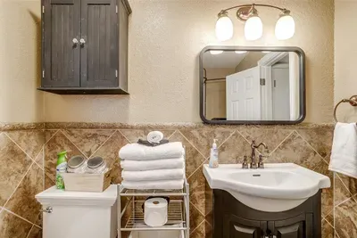 Well-appointed bathroom featuring all essentials, including plush towels, toiletries, and thoughtful design for a spa-like experience
