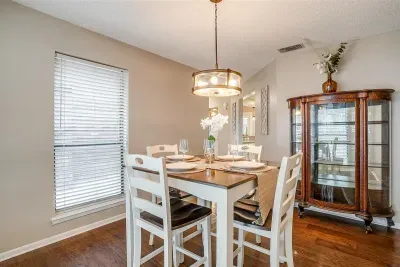 Spacious kitchen with modern appliances, including a dishwasher, making meal preparation and cleanup a breeze during your stay
