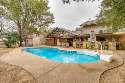 Have fun in the private pool featuring a basketball hoop, perfect for family-friendly entertainment and cooling off on sunny days
