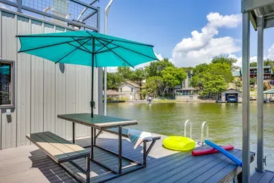 Shaded dock table with a swim ladder into the water