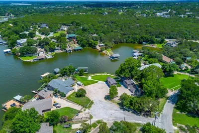 Bird's-eye view of the peaceful cove and tree-lined shore