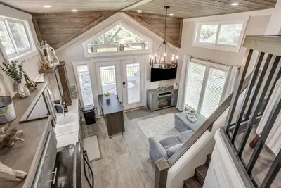 Loft-level view over the open living and dining space