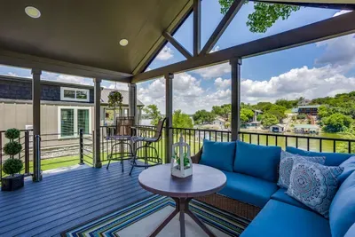 Relax on the porch sofa with the lake in view