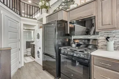 Full gas kitchen with laundry and bath just steps away