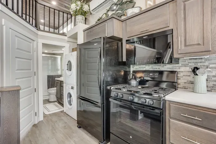 Full gas kitchen with laundry and bath just steps away