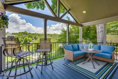 Sip a drink on the porch with treetop lake views