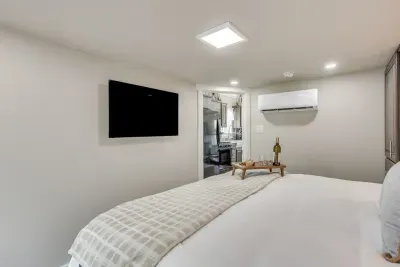 King bed with a smart TV and an open, cozy layout
