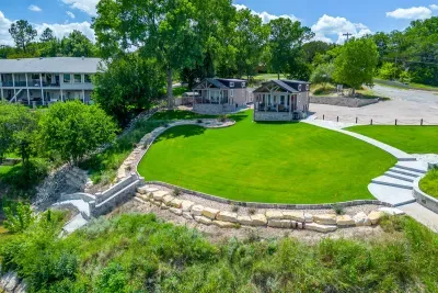 Sweeping green lawn rolls right down to the water's edge