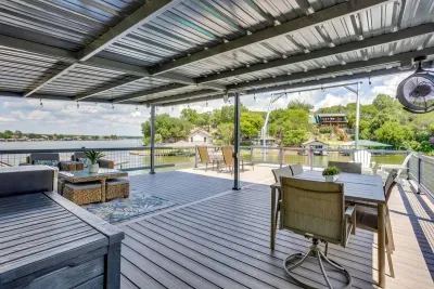 Dine and unwind on the breezy covered deck above the lake