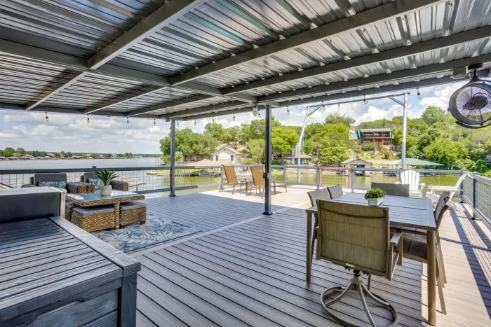 Dine and unwind on the breezy covered deck above the lake