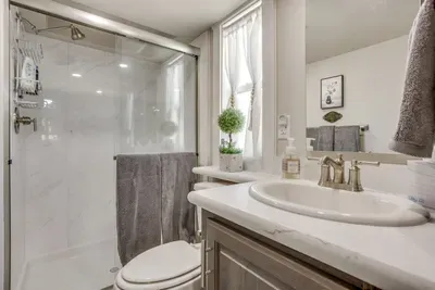 Spa-like walk-in shower in a bright, clean bathroom
