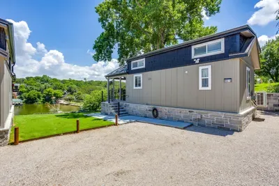 Sleek tiny home with a stone base and easy parking