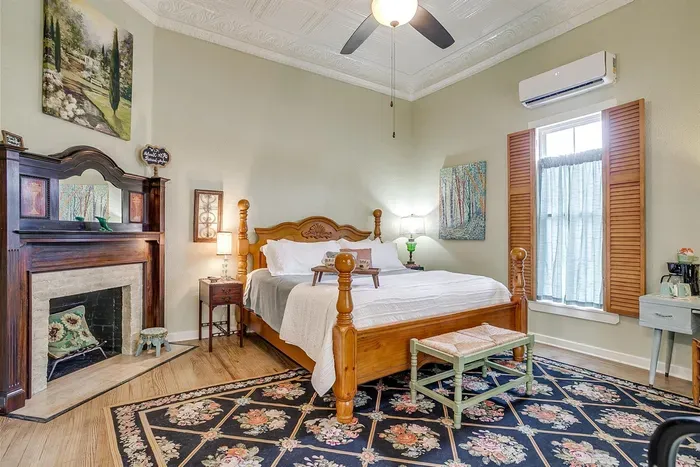 Bright and inviting room featuring a king-size bed and stylish decor, perfect for a cozy getaway