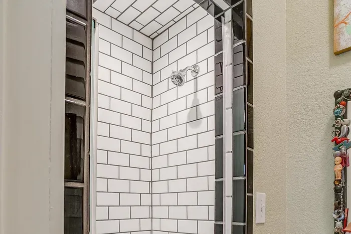 Spacious walk-in shower in the ensuite bathroom, offering modern fixtures and a refreshing spa-like experience