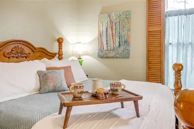Relax in a plush king-size bed with luxurious linens, offering ultimate comfort for a restful night's sleep