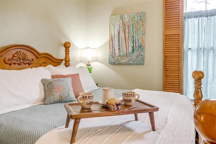 Relax in a plush king-size bed with luxurious linens, offering ultimate comfort for a restful night's sleep