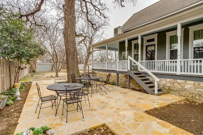 Enjoy a tranquil evening on the spacious rock patio, designed for relaxation and outdoor dining