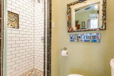 This luxurious walk-in shower offers a spa-like experience with sleek tiles and modern fixtures. It’s a perfect place to relax and refresh, featuring both functionality and style for a soothing start or end to your day.
