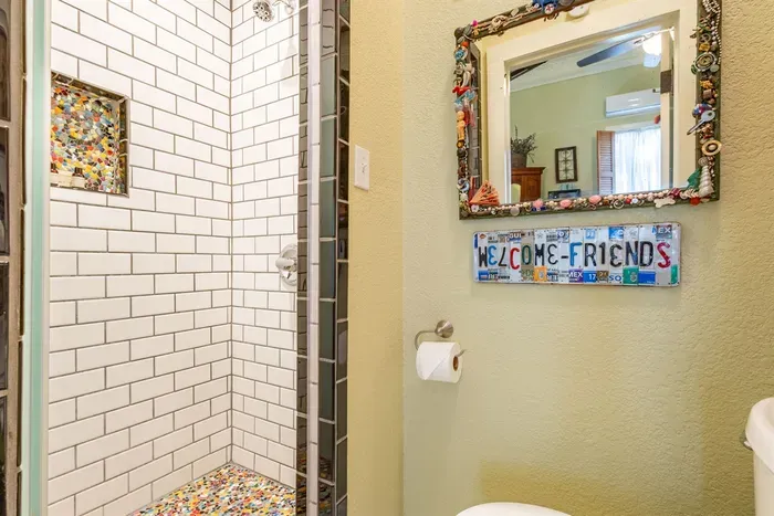 This luxurious walk-in shower offers a spa-like experience with sleek tiles and modern fixtures. It’s a perfect place to relax and refresh, featuring both functionality and style for a soothing start or end to your day.