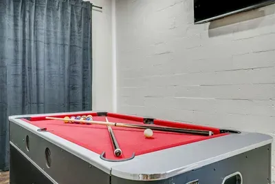 Multi-game table includes pool, ping pong, and air hockey for nonstop family fun