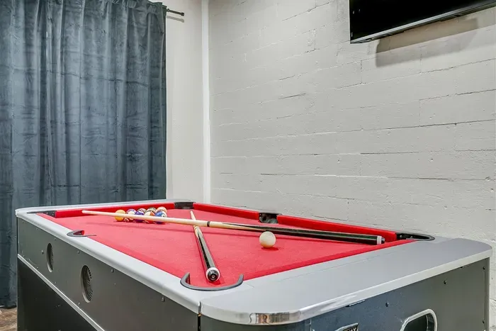 Multi-game table includes pool, ping pong, and air hockey for nonstop family fun