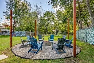 Evenings come alive under string lights around the firepit with seating for 8