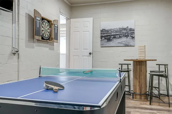 Casual fun with a full dart board setup and rustic game room vibes