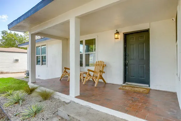 Covered front porch with seating—perfect for coffee or evening chats