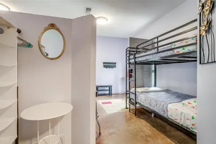 Twin bunk beds are perfect for kids or extra guests, tucked into their own nook for added privacy.