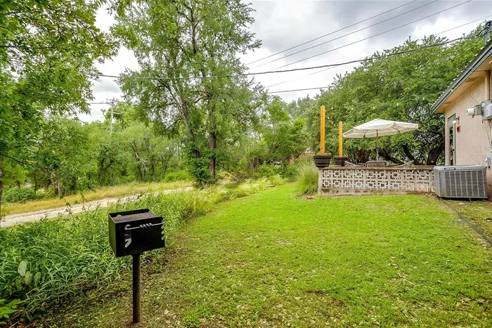 Picnic-style charcoal BBQ grill ready for outdoor cooking — bring your charcoal and enjoy grilling by the river.