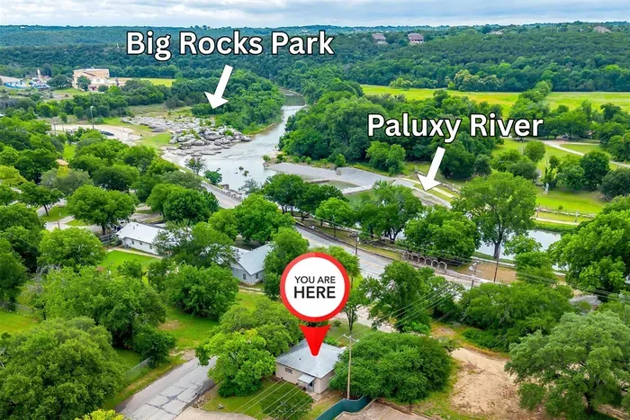 Aerial view shows Villa 101’s unbeatable location next to Big Rocks Park, the Paluxy River, and walking trails for endless outdoor fun.