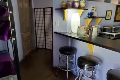 Features antique-style door, pedestal sink, and updated shower — a clean and stylish space to refresh.